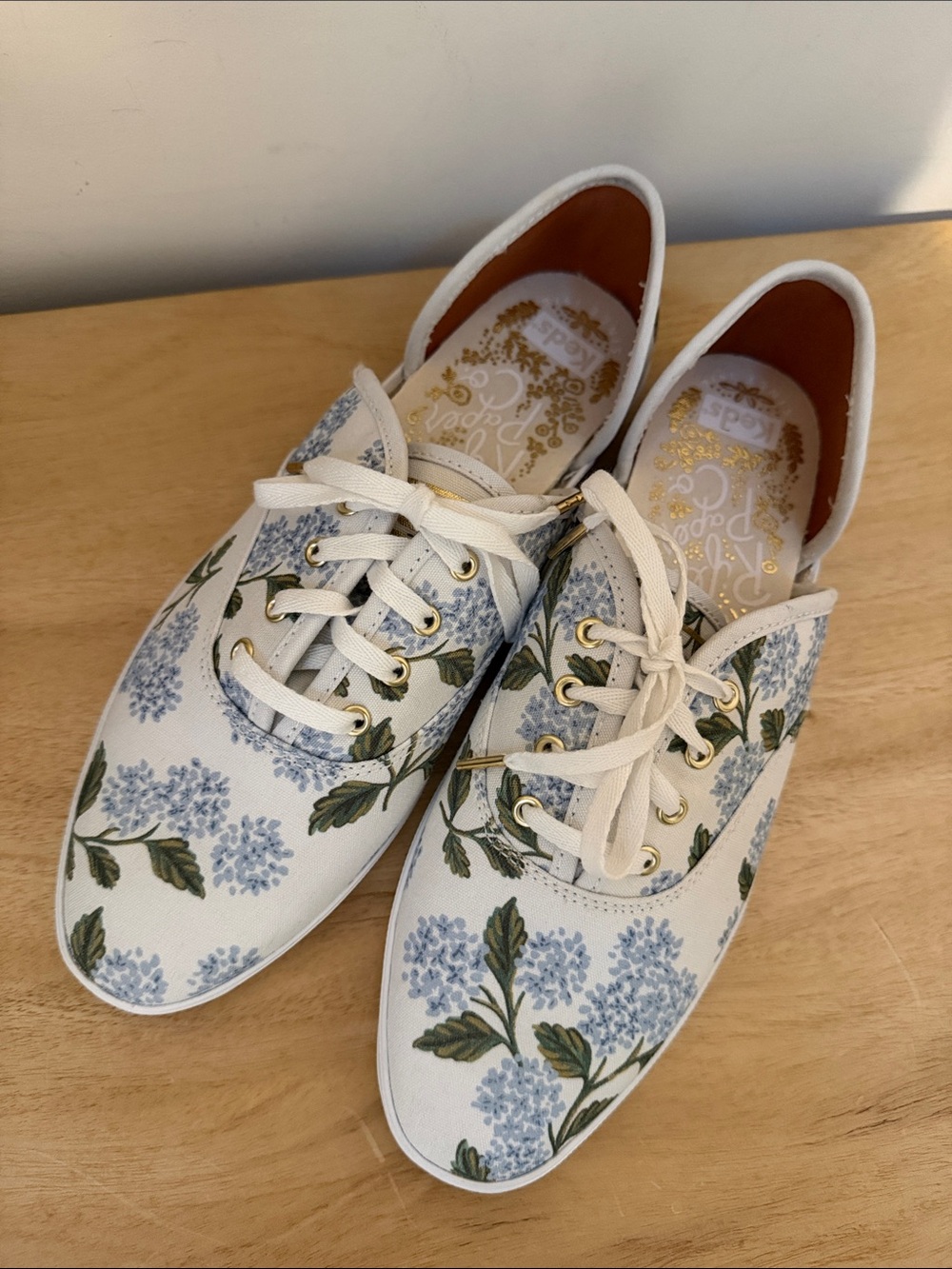 Keds White Canvas Sneakers with Blue Floral Print and Gold Accents